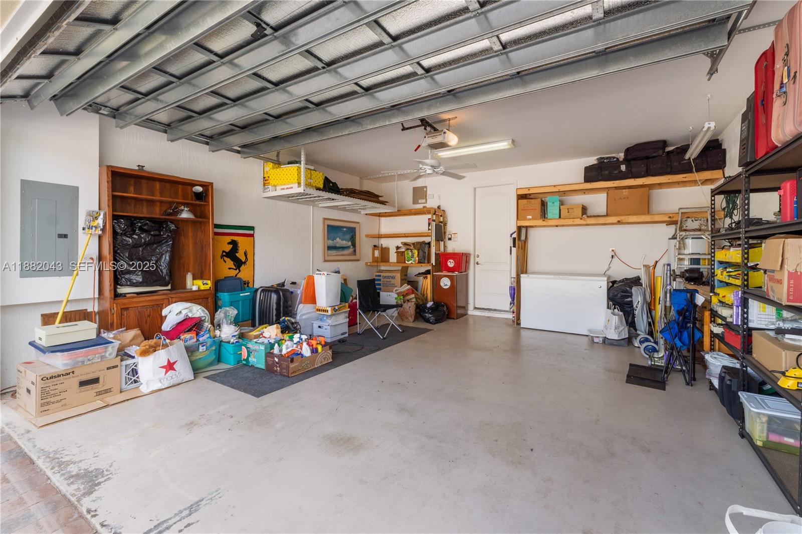 7702 Paddock Place, Unit 7702 Davie, FL 33328 - Photo 43 of 55 a view of a garage with toys