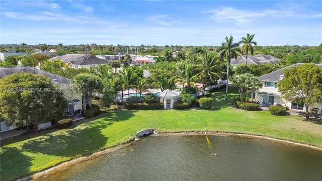 a view of swimming pool with outdoor seating and plants