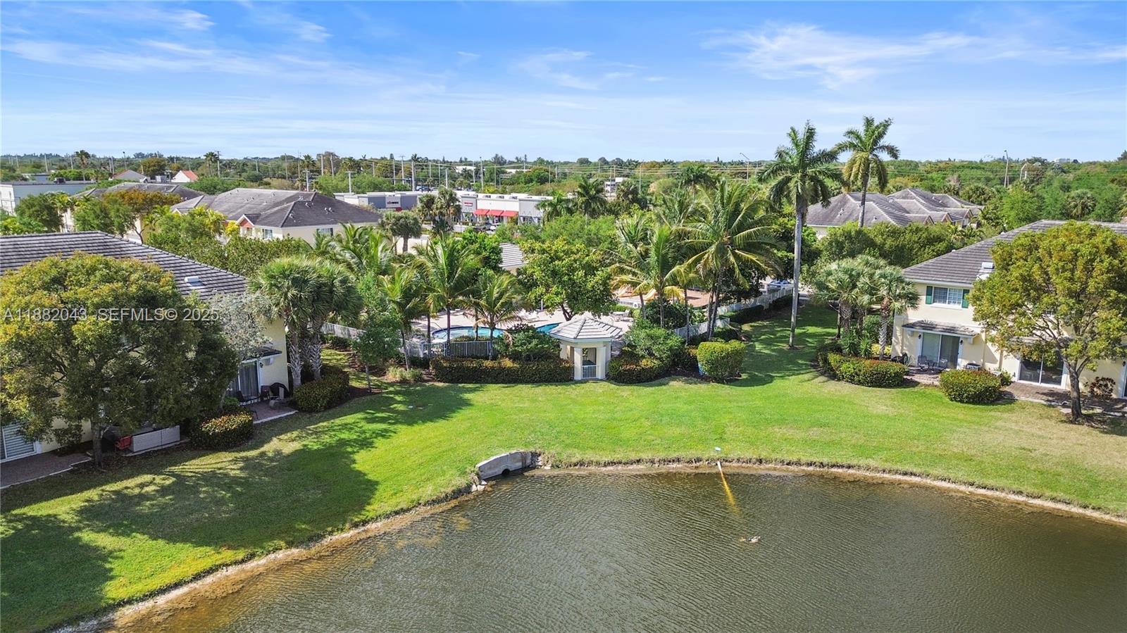 7702 Paddock Place, Unit 7702 Davie, FL 33328 - Photo 47 of 55 an aerial view of a houses with yard and green space