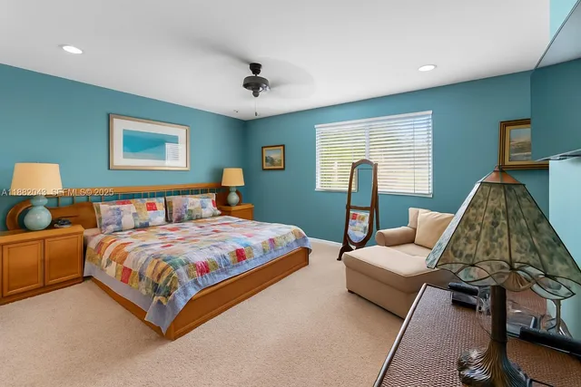 a bedroom with bed and window