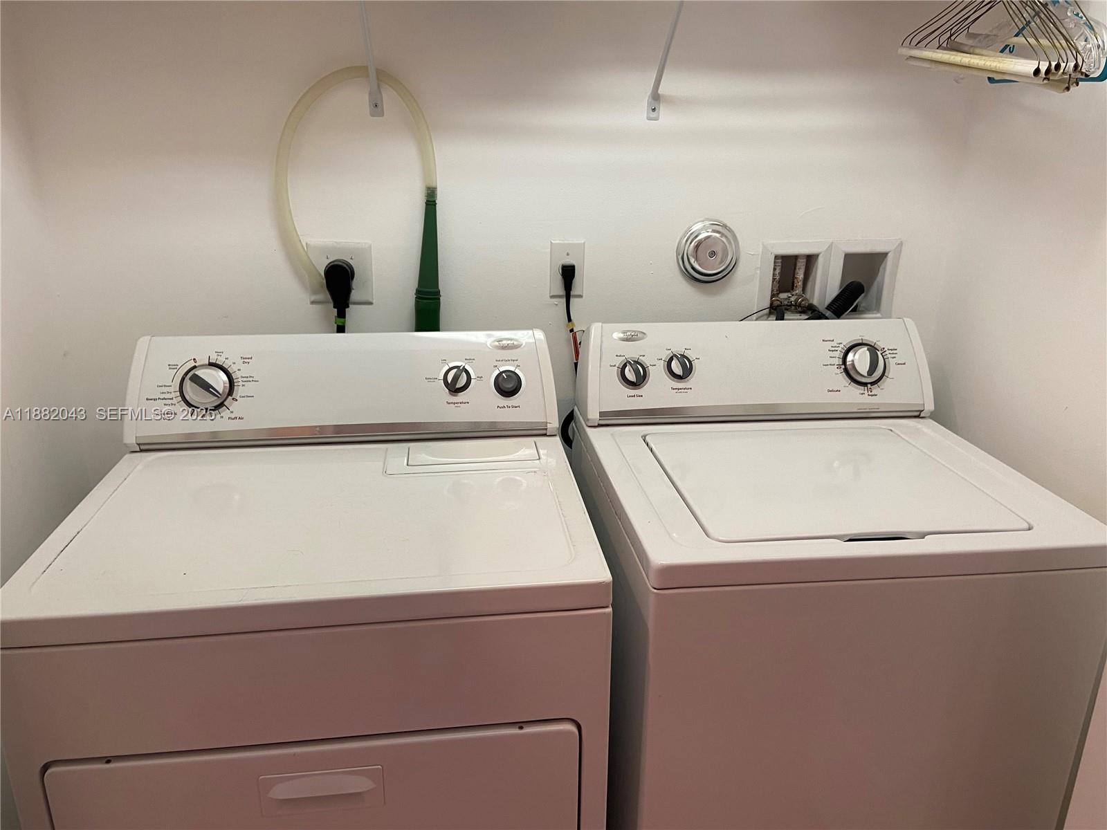 7702 Paddock Place, Unit 7702 Davie, FL 33328 - Photo 54 of 55 a utility room with dryer and washer