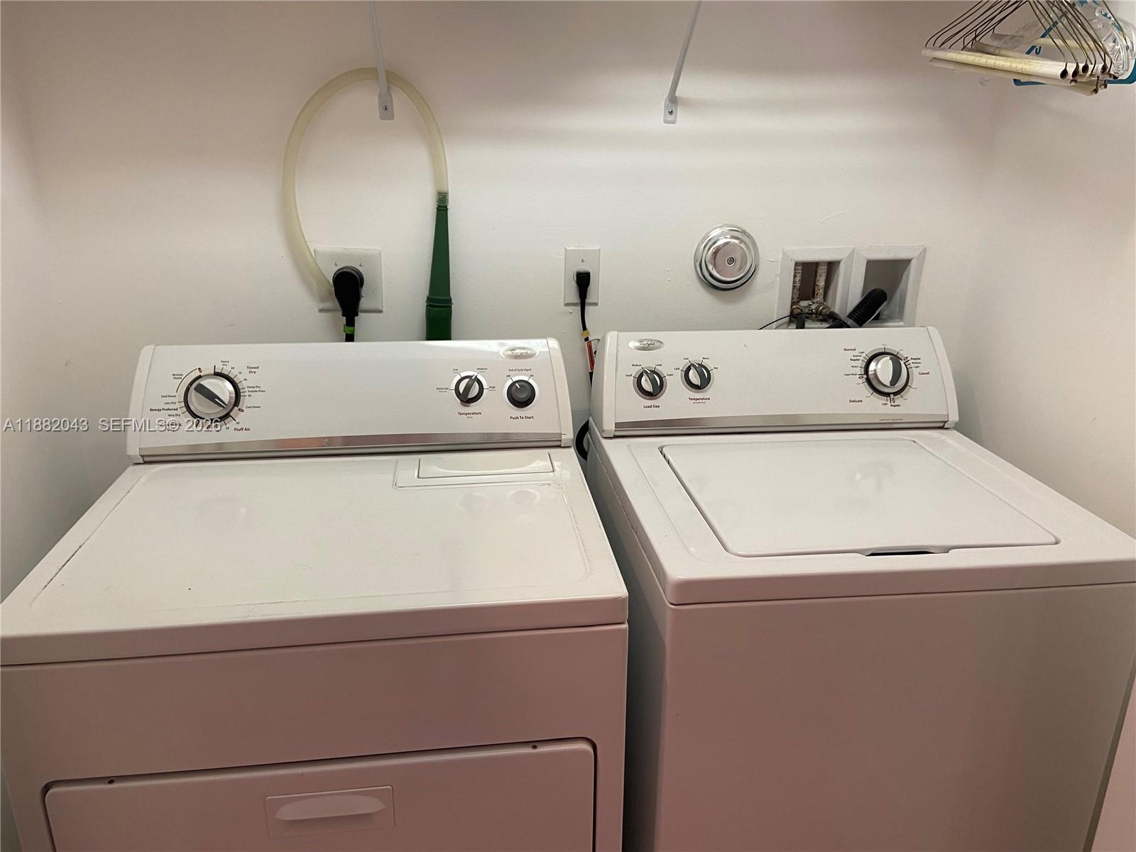 7702 Paddock Place, Unit 7702 Davie, FL 33328 - Photo 54 of 55 a utility room with dryer and washer
