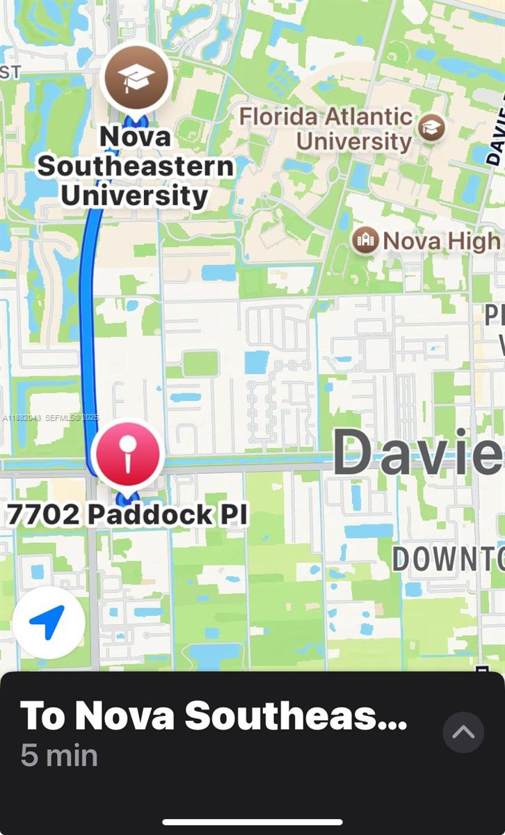 7702 Paddock Place, Unit 7702 Davie, FL 33328 - Photo 55 of 55 a picture of a book and a table