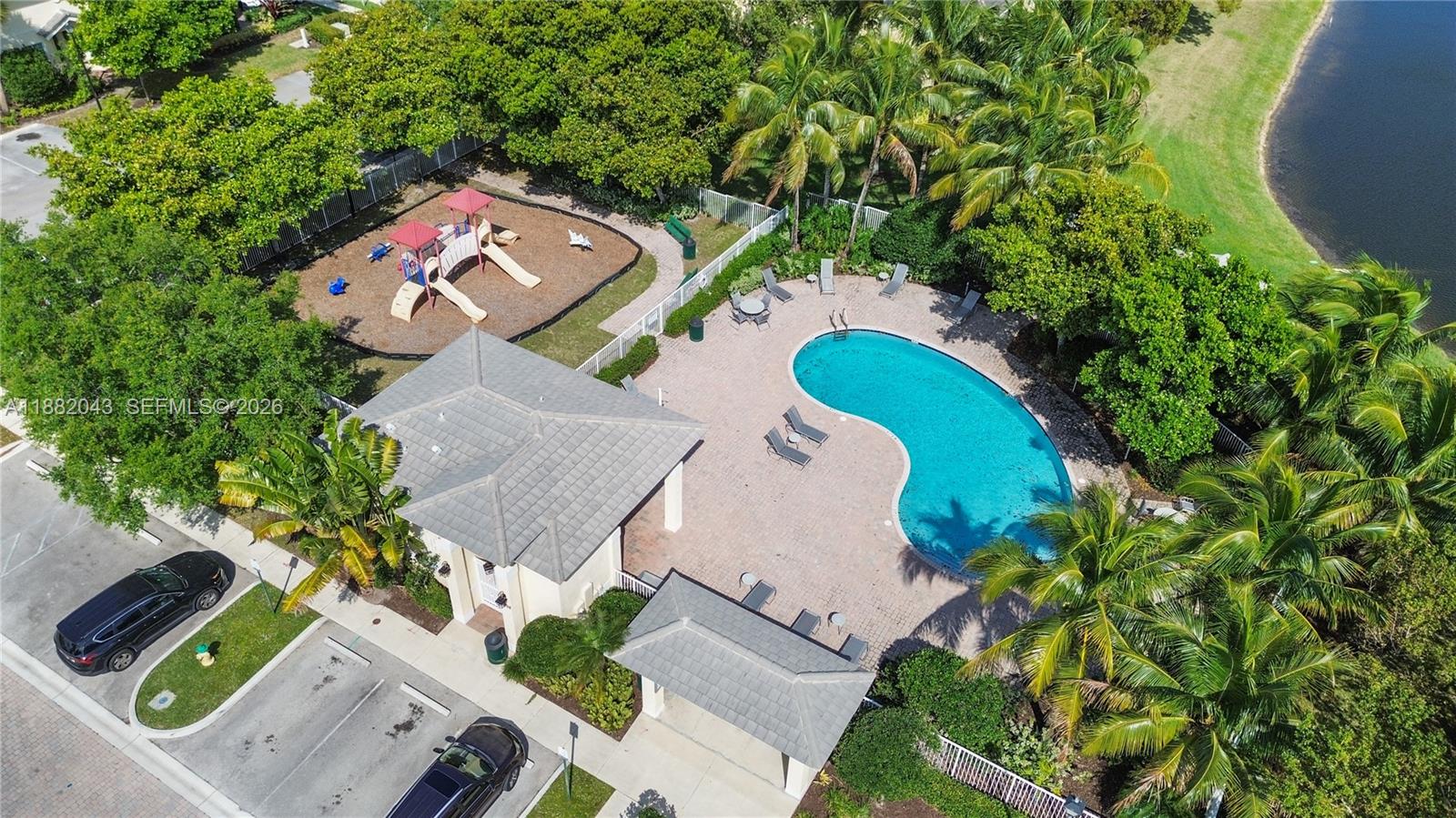 7702 Paddock Place, Unit 7702 Davie, FL 33328 - Photo 9 of 55 an aerial view of a house with a swimming pool and garden