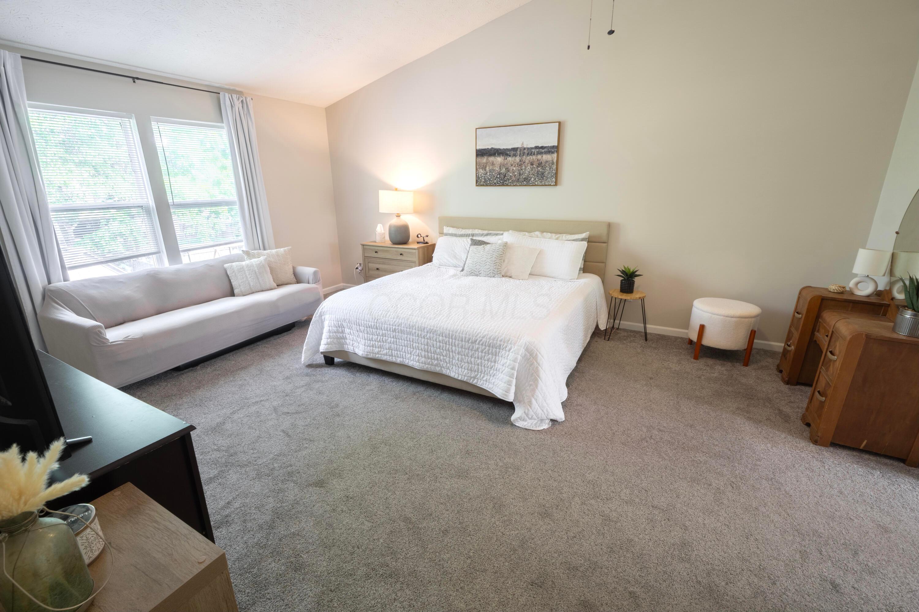 160 Kettering Bend Delaware, OH 43015 - Photo 21 of 49 A highlight of the home is this large primary bedroom with vaulted ceiling and windows overlooking the backyard!