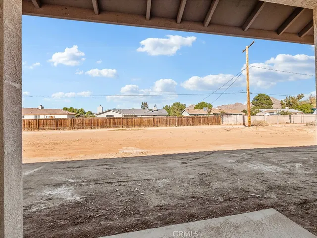 a view of a house next to a big yard