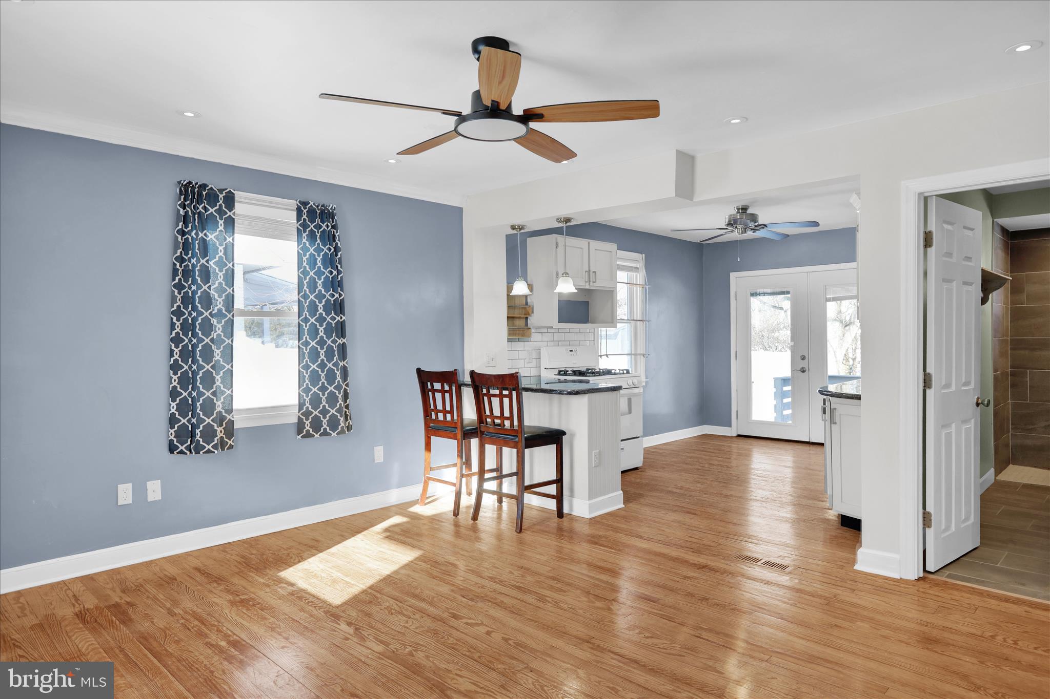 821 Bellefonte Avenue Reading, PA 19607 - Photo 5 of 37 a view of a livingroom with furniture a ceiling fan and wooden floor