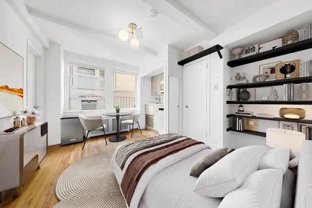 a bedroom with furniture and a wooden floor