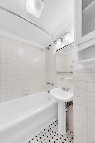 a view of a kitchen with wooden floor and electronic appliances