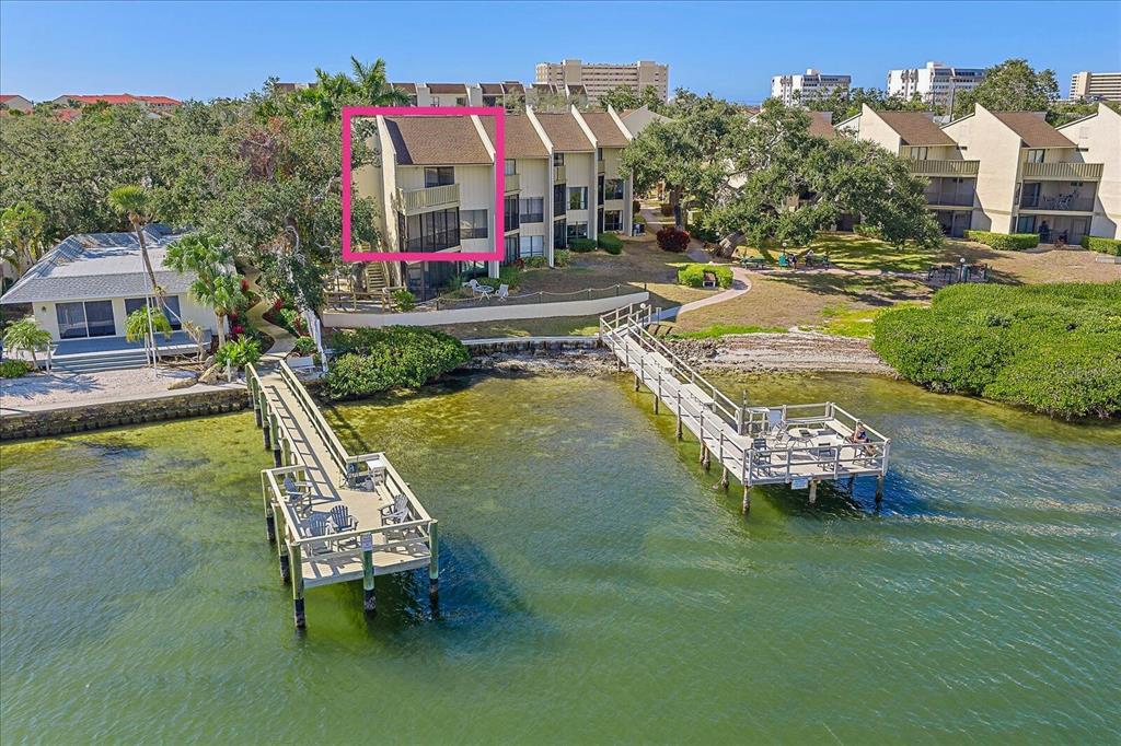 6157 Midnight Pass Road, Unit B12 Sarasota, FL 34242 - Photo 1 of 75 a swimming pool with barbeque oven outdoor seating and yard