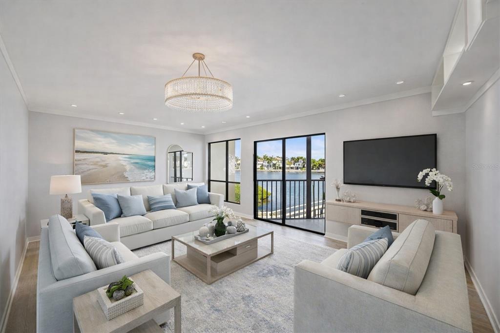 6157 Midnight Pass Road, Unit B12 Sarasota, FL 34242 - Photo 14 of 75 a living room with furniture and a flat screen tv