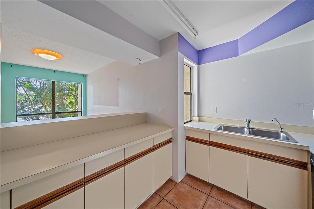 6157 Midnight Pass Road, Unit B12 Sarasota, FL 34242 - Photo 21 of 75 a en suite bathroom with a sink and mirror