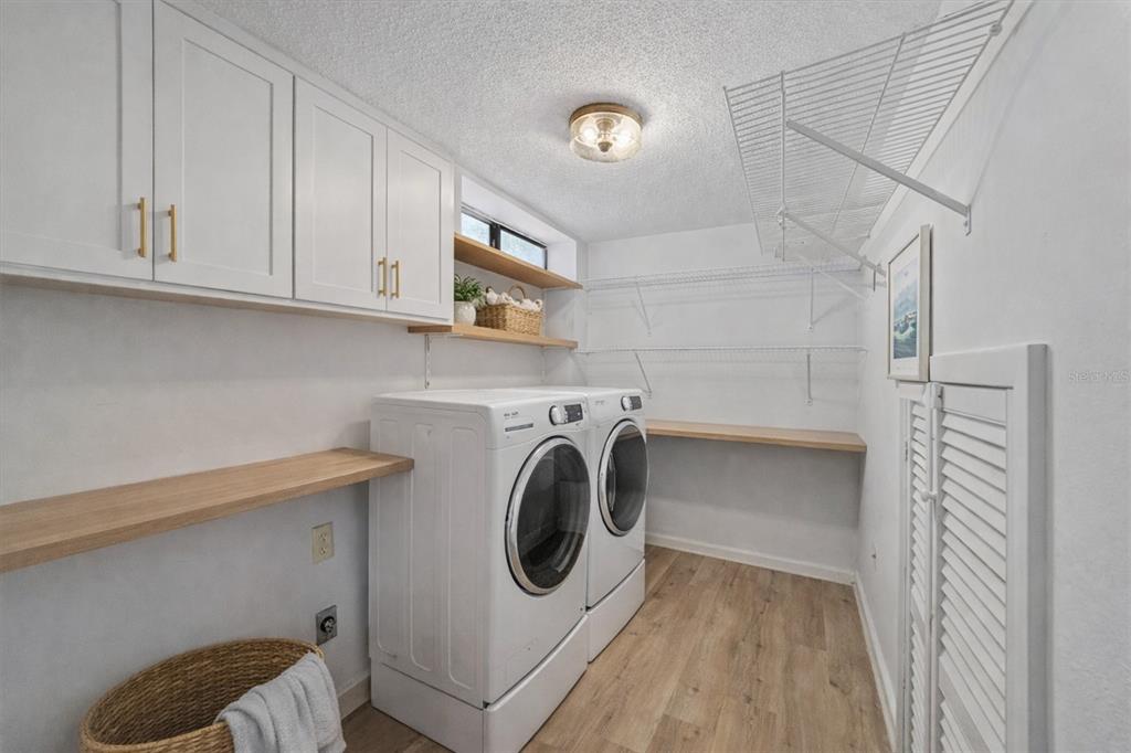 6157 Midnight Pass Road, Unit B12 Sarasota, FL 34242 - Photo 25 of 75 a utility room with dryer and washer