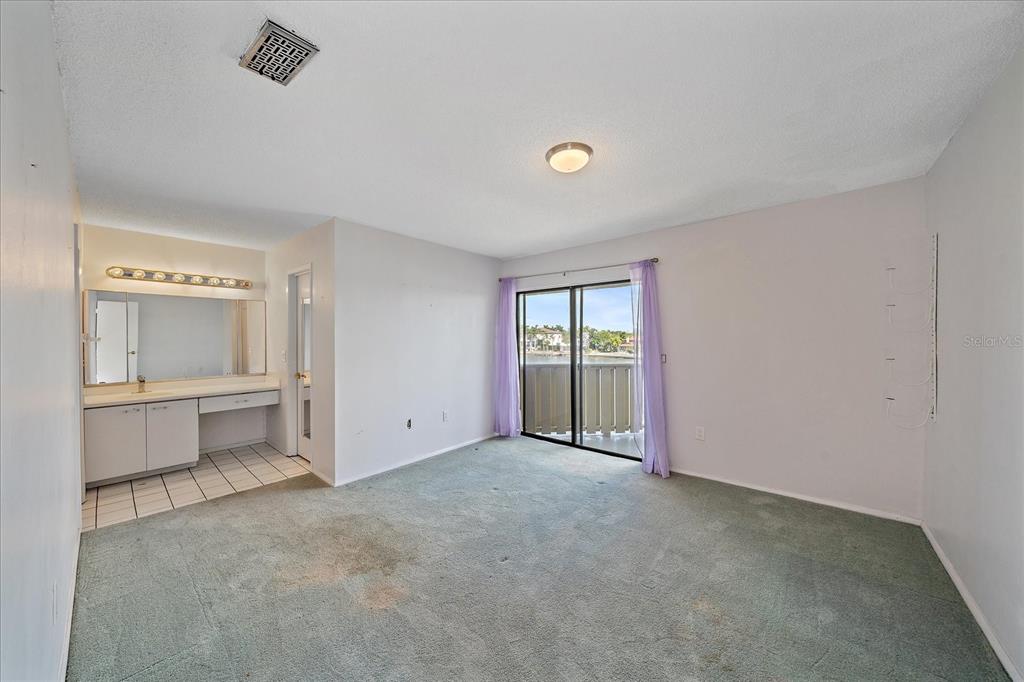 6157 Midnight Pass Road, Unit B12 Sarasota, FL 34242 - Photo 29 of 75 an empty room with a bathroom and a sink