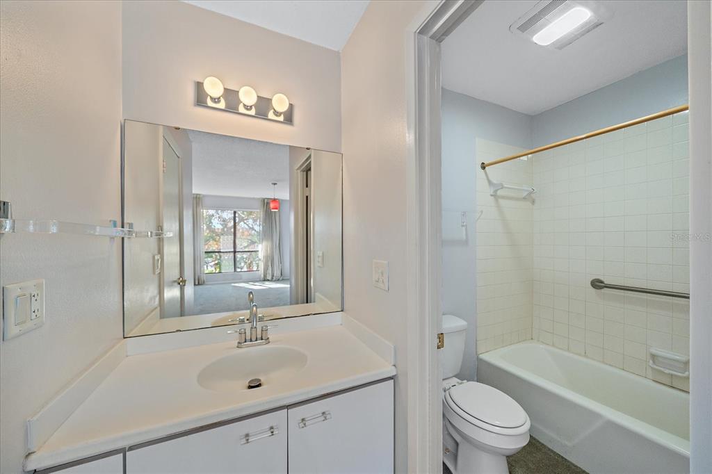 6157 Midnight Pass Road, Unit B12 Sarasota, FL 34242 - Photo 44 of 75 a bathroom with a sink a toilet and shower