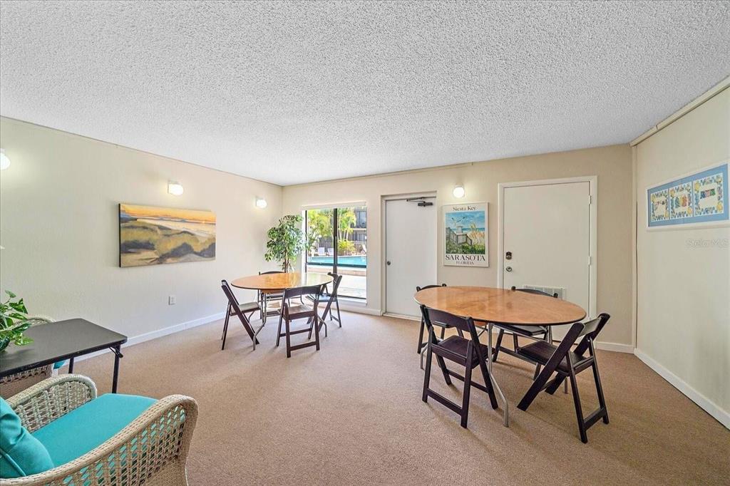 6157 Midnight Pass Road, Unit B12 Sarasota, FL 34242 - Photo 58 of 75 a dining room with a table and chairs