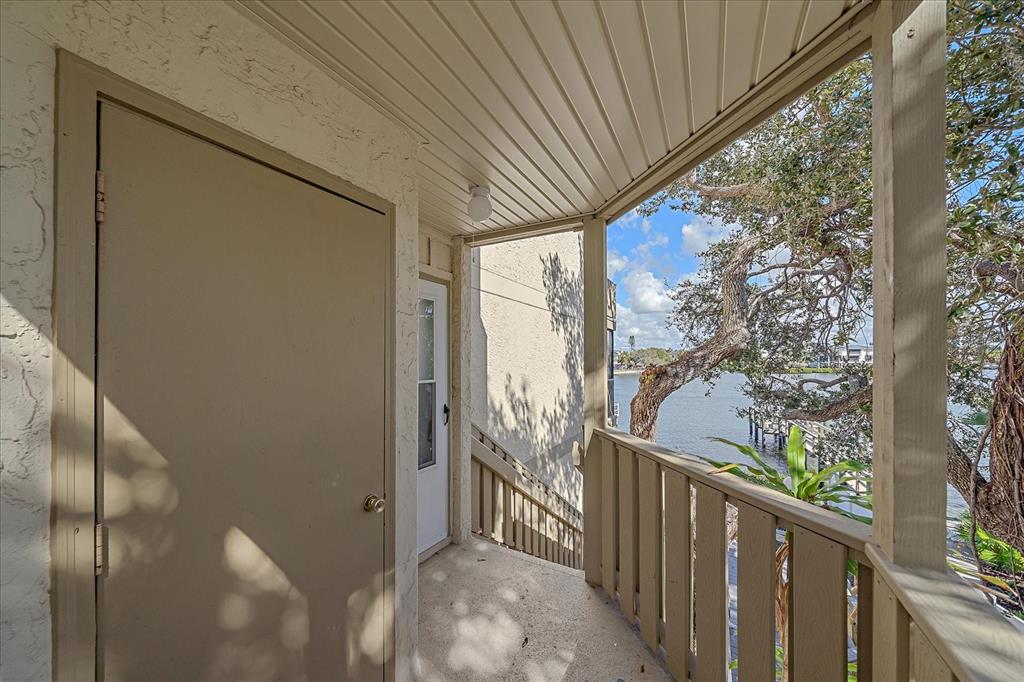 6157 Midnight Pass Road, Unit B12 Sarasota, FL 34242 - Photo 6 of 75 a view of a porch