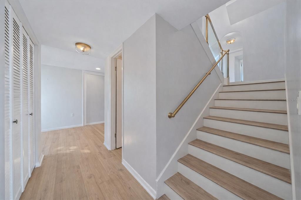 6157 Midnight Pass Road, Unit B12 Sarasota, FL 34242 - Photo 8 of 75 a view of entryway with wooden floor