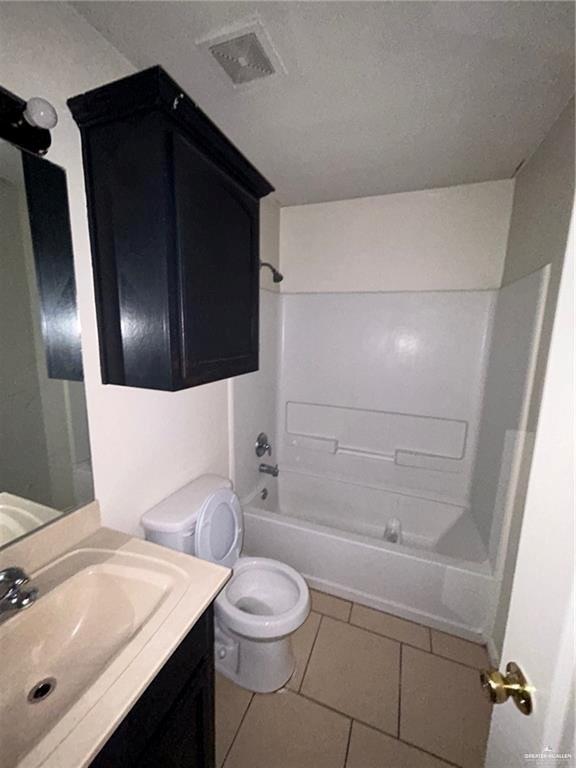 702 Jade Street, Unit B Edinburg, TX 78541 - Photo 8 of 9 a bathroom with a sink a toilet and shower