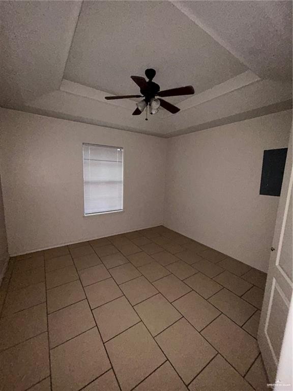 702 Jade Street, Unit B Edinburg, TX 78541 - Photo 9 of 9 a view of a livingroom with a chandelier fan and windows