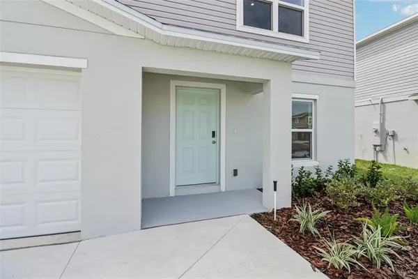a view of kitchen with wooden floor and window