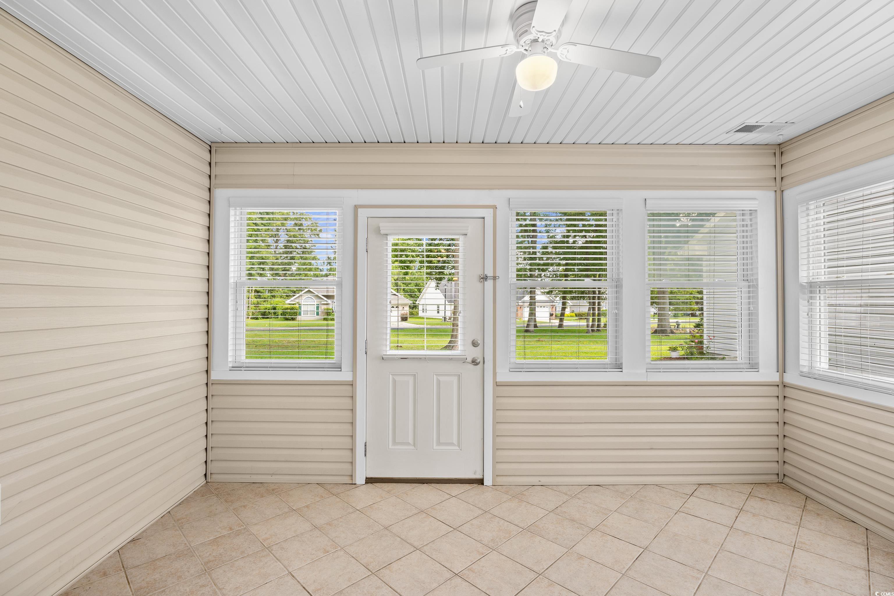 596 Oakmont Drive Myrtle Beach, SC 29579 - Photo 34 of 40 Unfurnished sunroom with ceiling fan