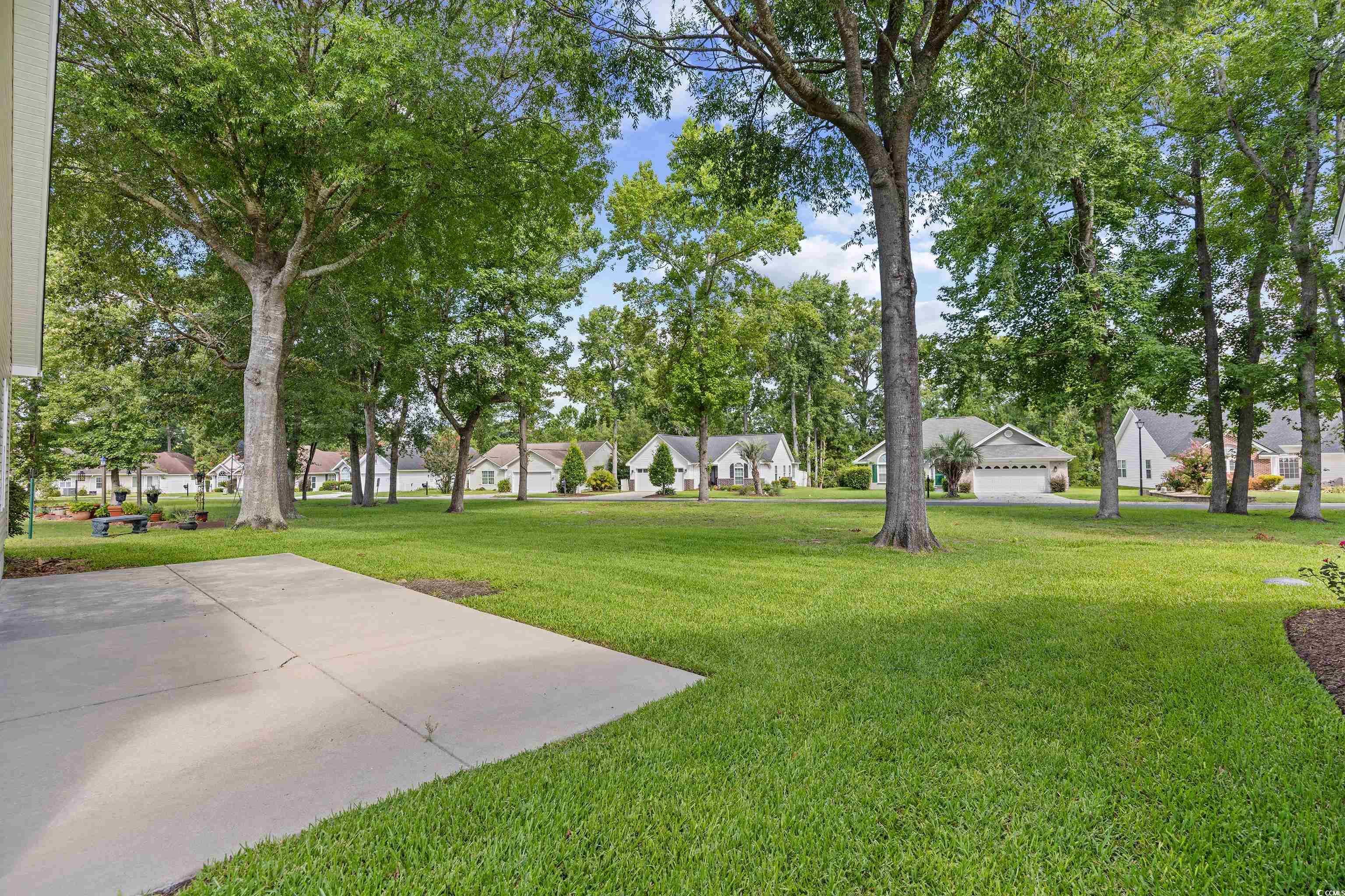 596 Oakmont Drive Myrtle Beach, SC 29579 - Photo 37 of 40 View of grassy yard featuring a residential view