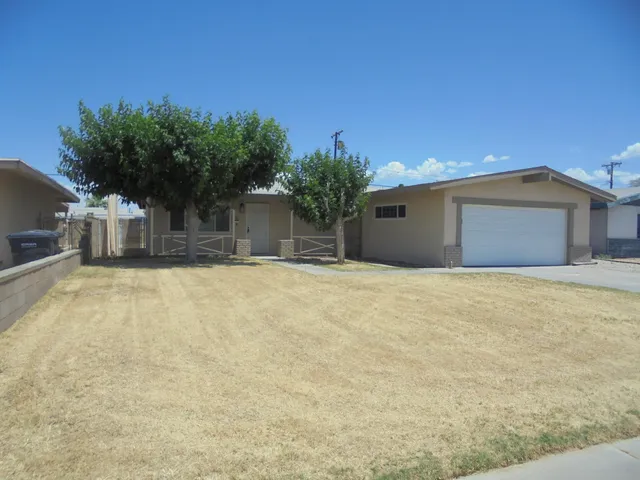 a house with trees in front of it