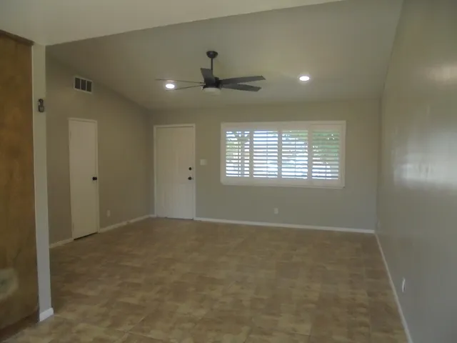 a view of an empty room with a window