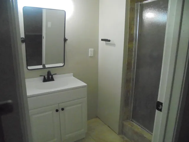 a bathroom with a sink and mirror