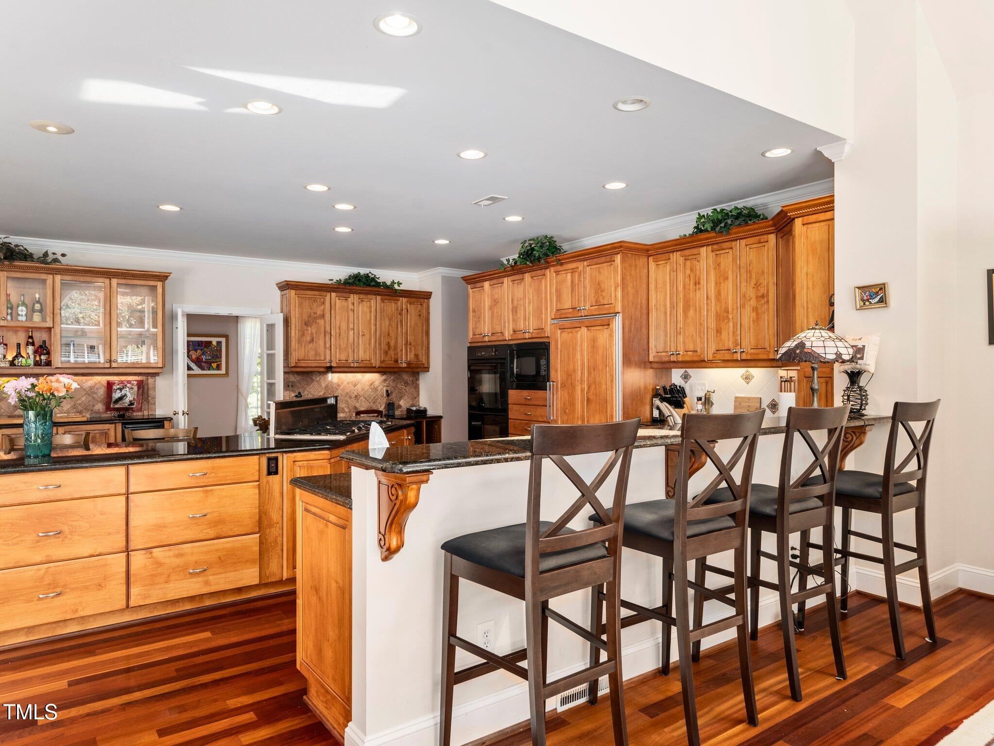 10937 Cahill Road Raleigh, NC 27614 - Photo 19 of 53 Second Eat-at Bar overlooks Kit for more Casual Dining