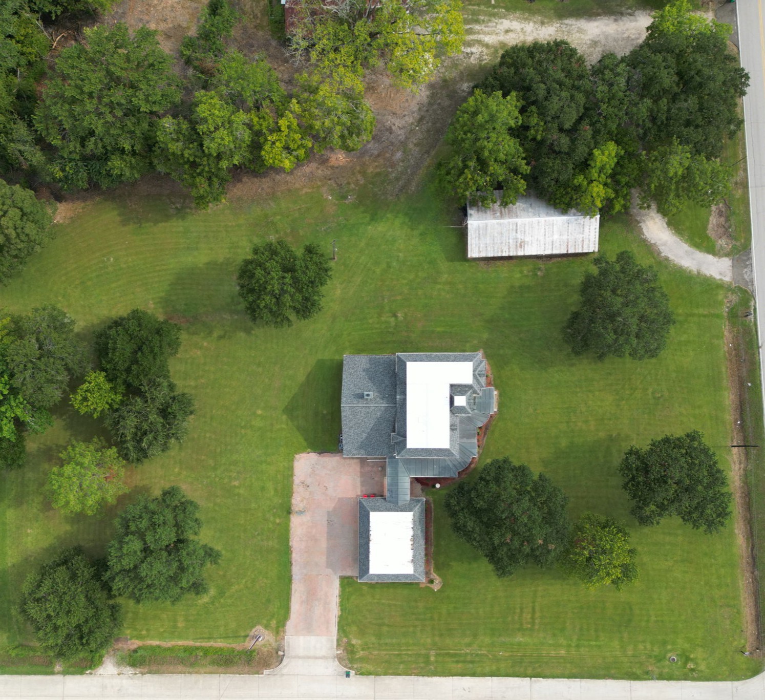 4028 Crosby Cedar Bayou Road Baytown, TX 77521 - Photo 32 of 35 Aerial view of 4028 Crosby Cedar Bayou Dr., highlighting the home, detached shop, and 2-acre property.