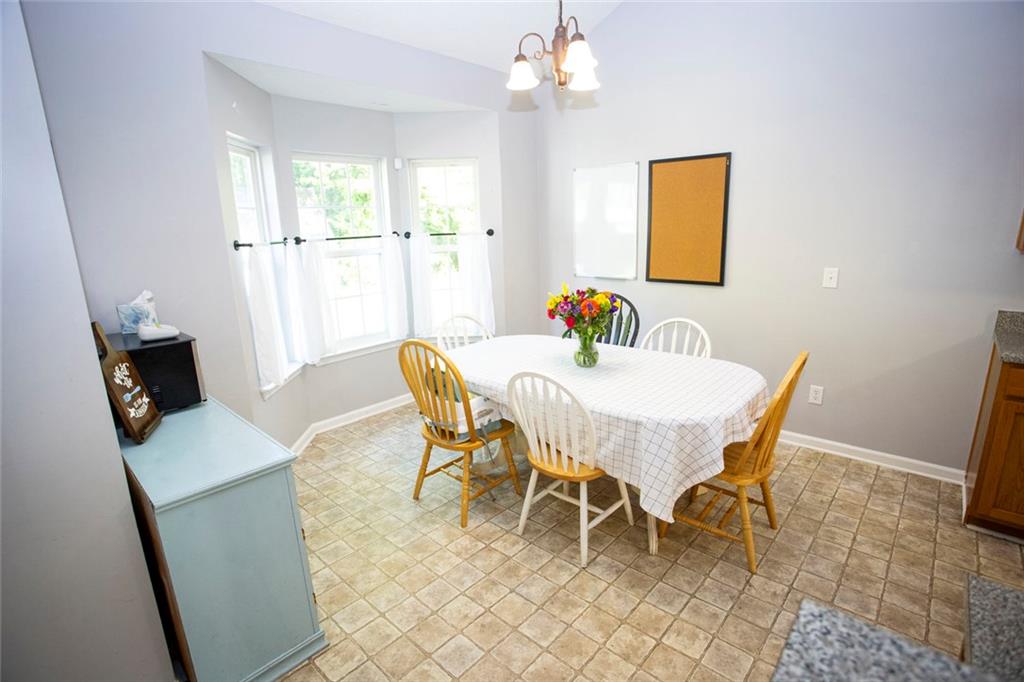 306 Old Gettysburg Way Dallas, GA 30157 - Photo 12 of 44 a view of a dining room with furniture and window