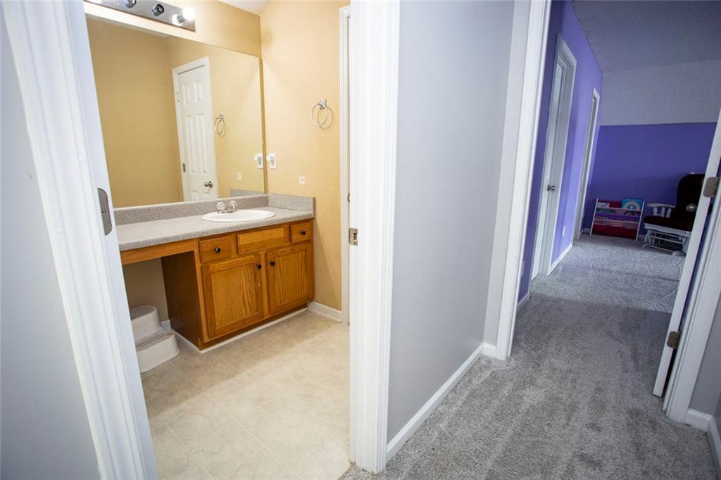 306 Old Gettysburg Way Dallas, GA 30157 - Photo 17 of 44 a bathroom with a sink and a mirror