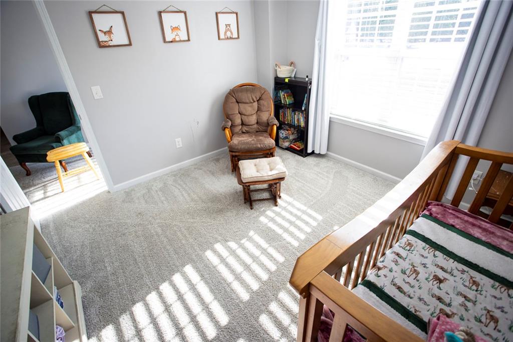 306 Old Gettysburg Way Dallas, GA 30157 - Photo 19 of 44 a living room with chairs and a window