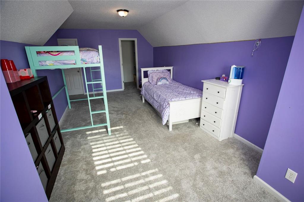 306 Old Gettysburg Way Dallas, GA 30157 - Photo 23 of 44 a bedroom with a bed and a dresser