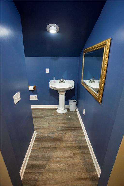 306 Old Gettysburg Way Dallas, GA 30157 - Photo 38 of 44 a view of a hallway with wooden floor and a toilet