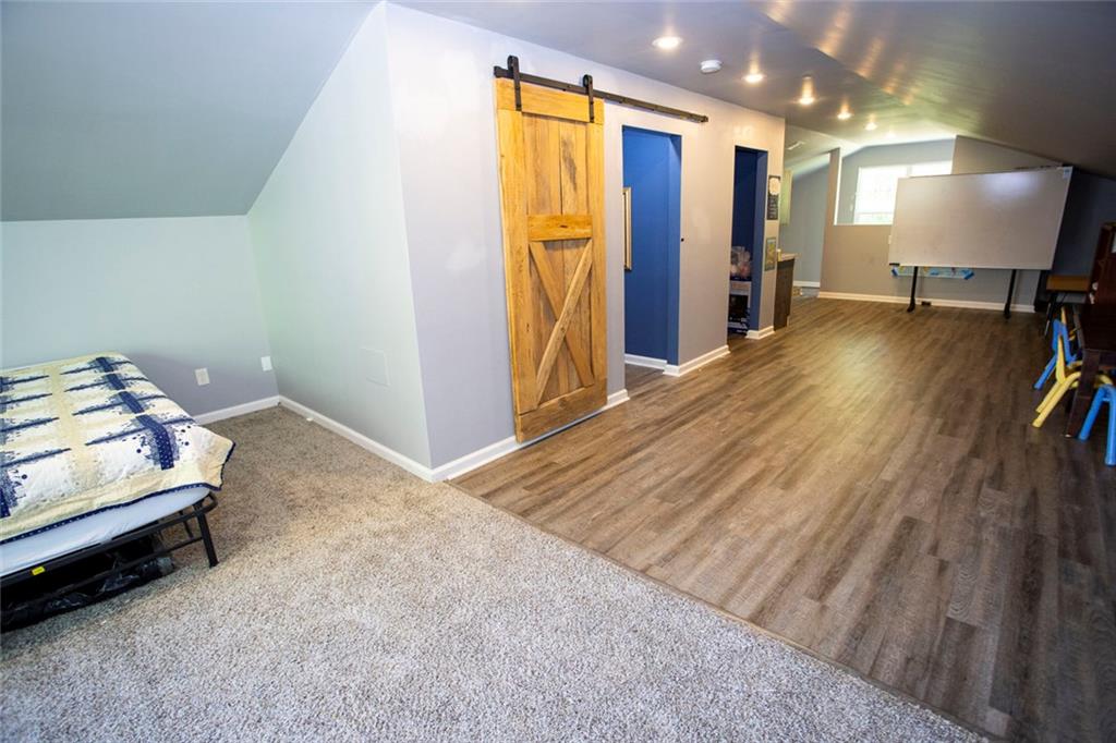 306 Old Gettysburg Way Dallas, GA 30157 - Photo 40 of 44 a view of a hallway with workspace