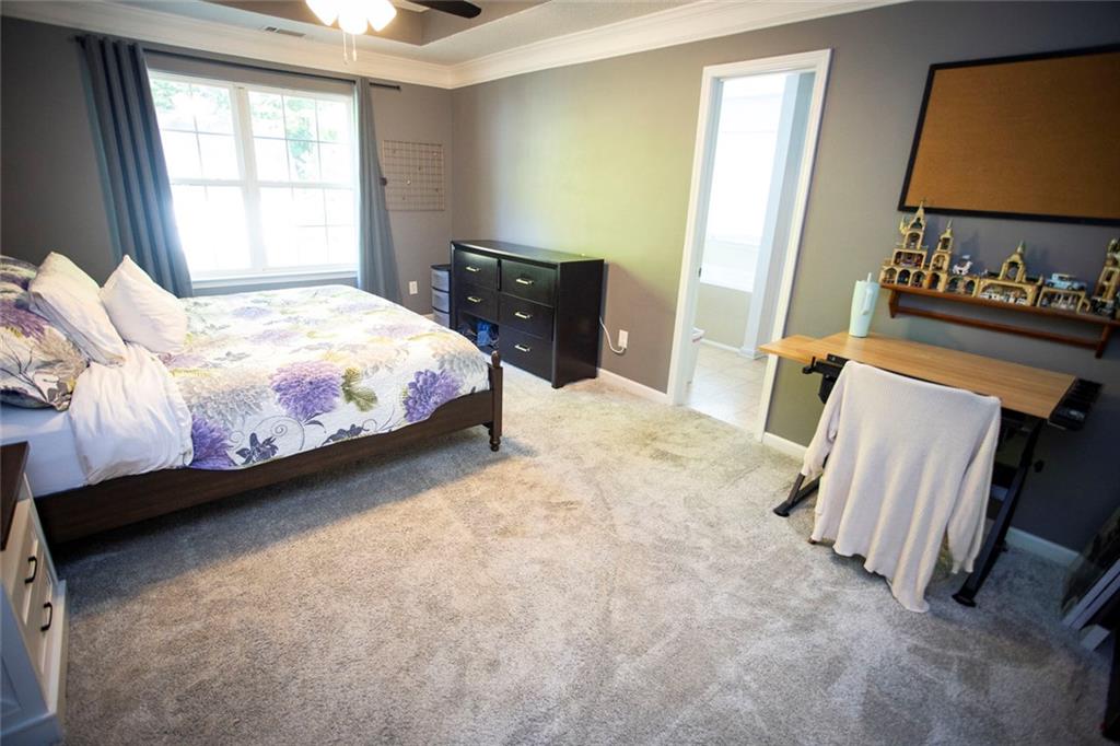 306 Old Gettysburg Way Dallas, GA 30157 - Photo 5 of 44 a bedroom with a bed and wooden floor