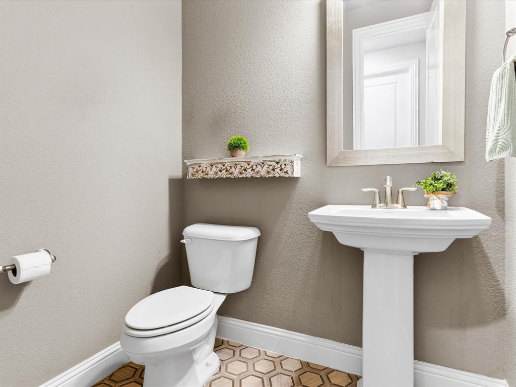 1630 Pebblebrook Lane Prosper, TX 75078 - Photo 13 of 40 a bathroom with a sink toilet and a mirror