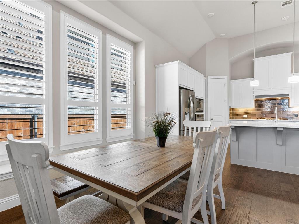 1630 Pebblebrook Lane Prosper, TX 75078 - Photo 19 of 40 a view of a dining room with furniture and window