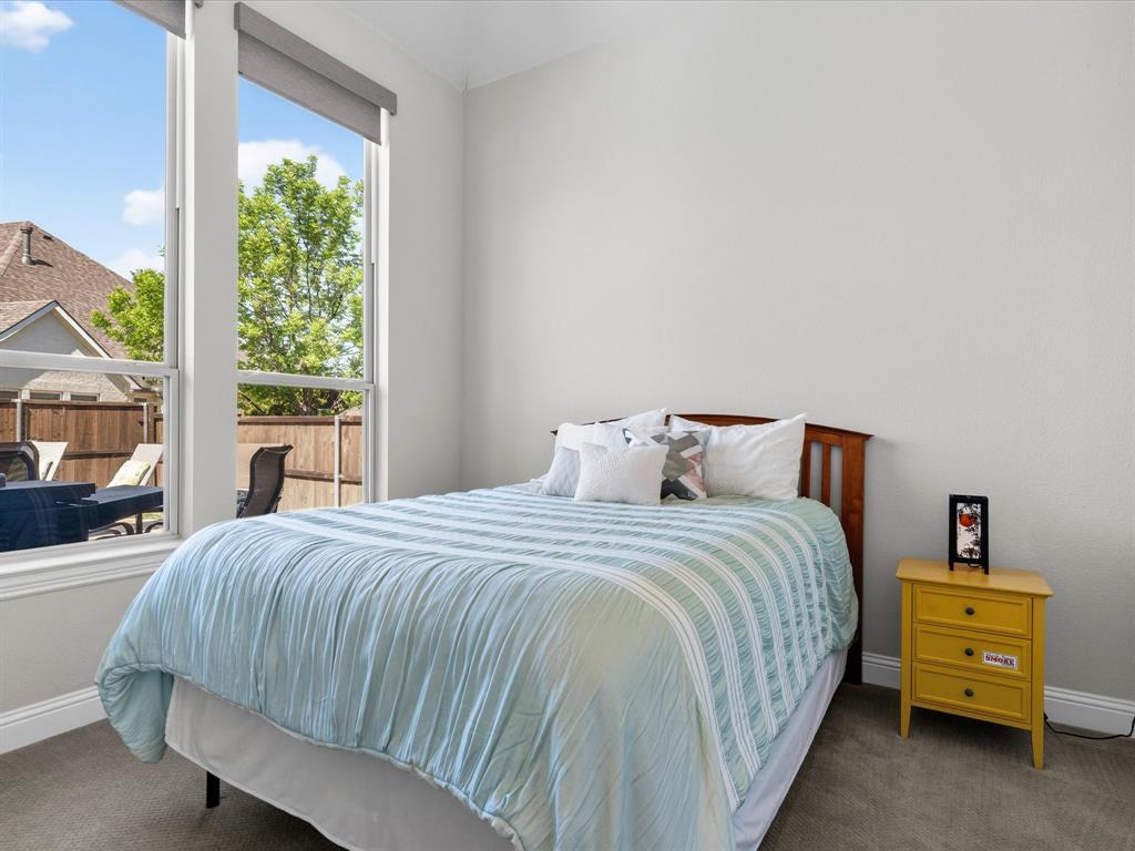 1630 Pebblebrook Lane Prosper, TX 75078 - Photo 24 of 40 a bedroom with a bed and a window