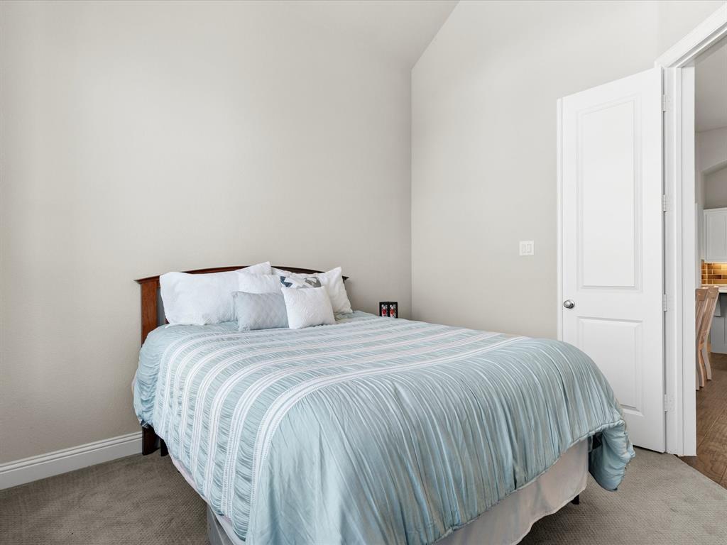 1630 Pebblebrook Lane Prosper, TX 75078 - Photo 25 of 40 a bedroom with a bed and a window