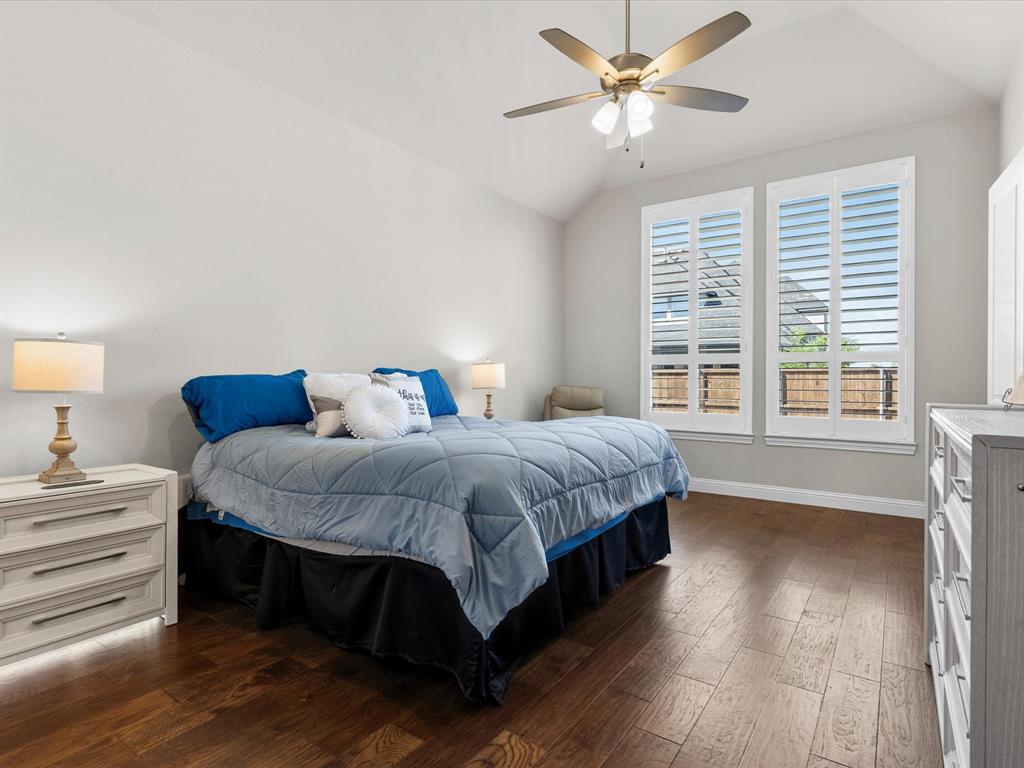 1630 Pebblebrook Lane Prosper, TX 75078 - Photo 27 of 40 a spacious bedroom with a bed and a large window