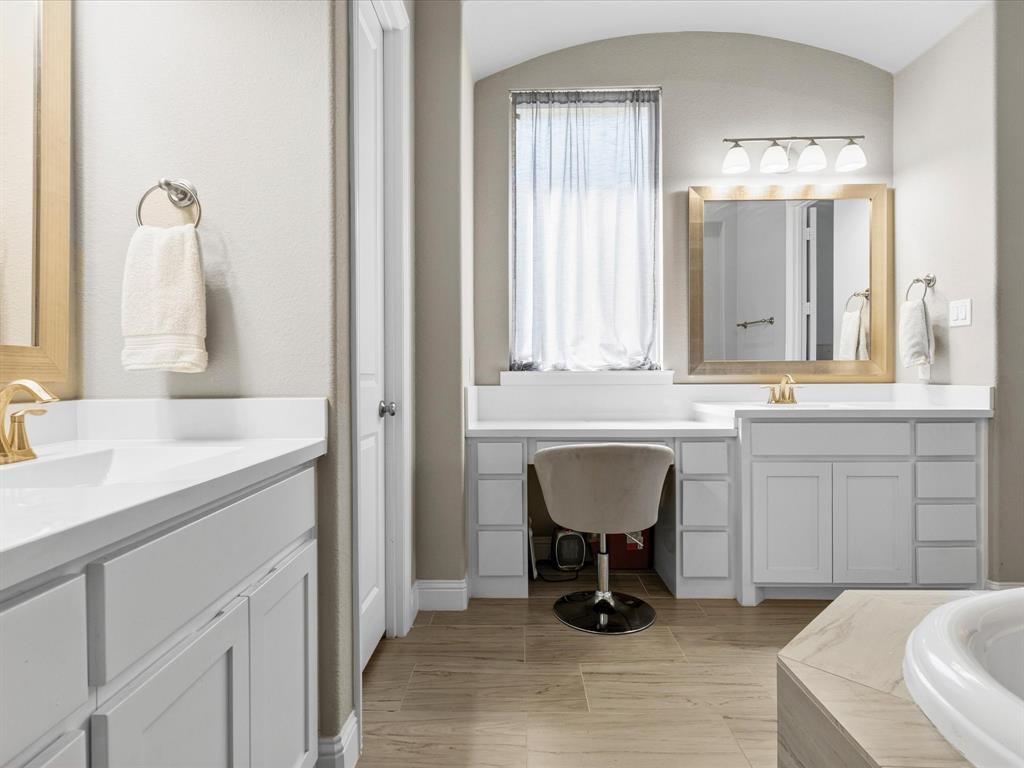 1630 Pebblebrook Lane Prosper, TX 75078 - Photo 29 of 40 a bathroom with a sink and a mirror