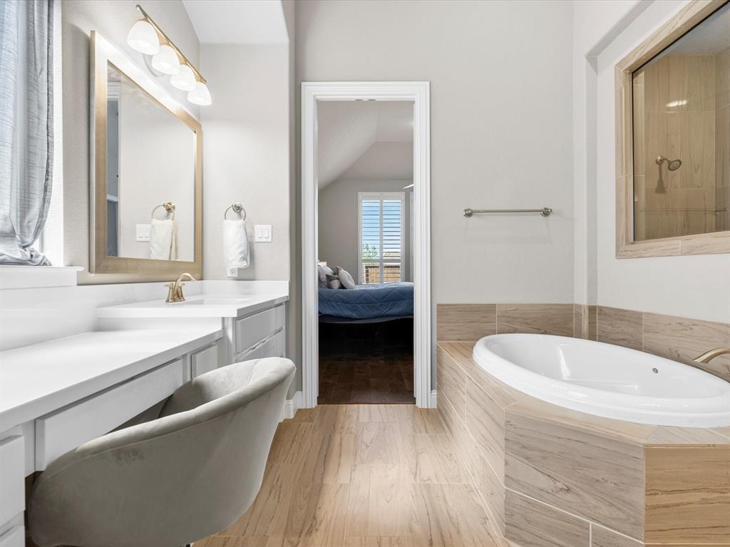 1630 Pebblebrook Lane Prosper, TX 75078 - Photo 31 of 40 a en suite bathroom with a granite countertop tub sink and mirror