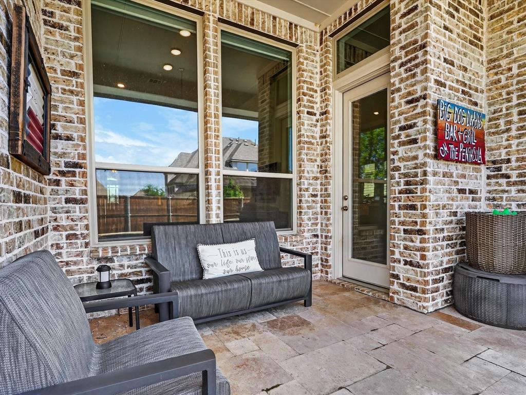 1630 Pebblebrook Lane Prosper, TX 75078 - Photo 32 of 40 a balcony with couch and a potted plant