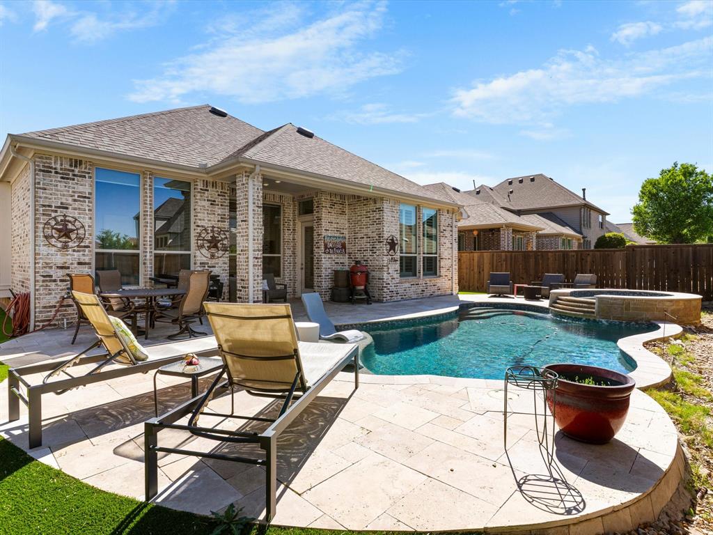 1630 Pebblebrook Lane Prosper, TX 75078 - Photo 36 of 40 a view of a house with backyard sitting area and garden