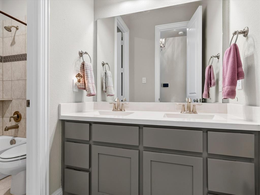 1630 Pebblebrook Lane Prosper, TX 75078 - Photo 8 of 40 a bathroom with a sink and a mirror