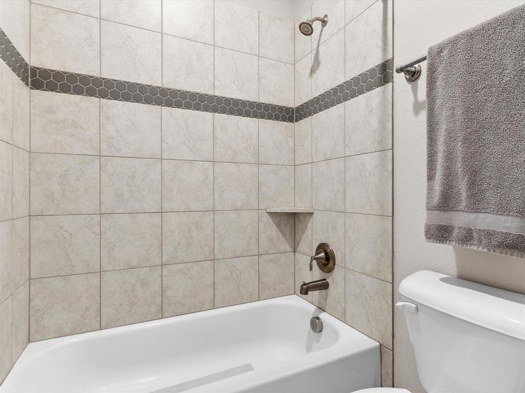 1630 Pebblebrook Lane Prosper, TX 75078 - Photo 9 of 40 a bathroom with a bathtub and a shower